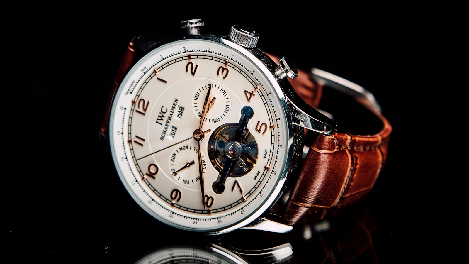 Three wristwatches lined up showing different dial styles