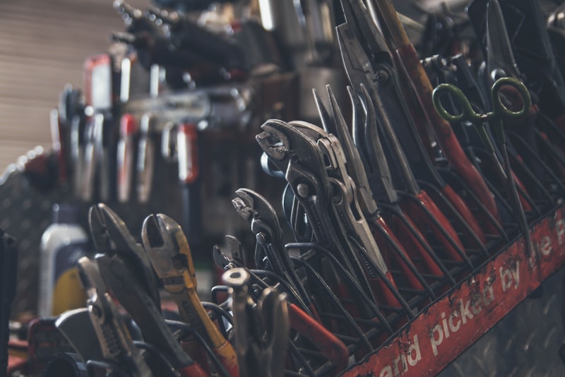 Folding multitool with pliers and bits laid open