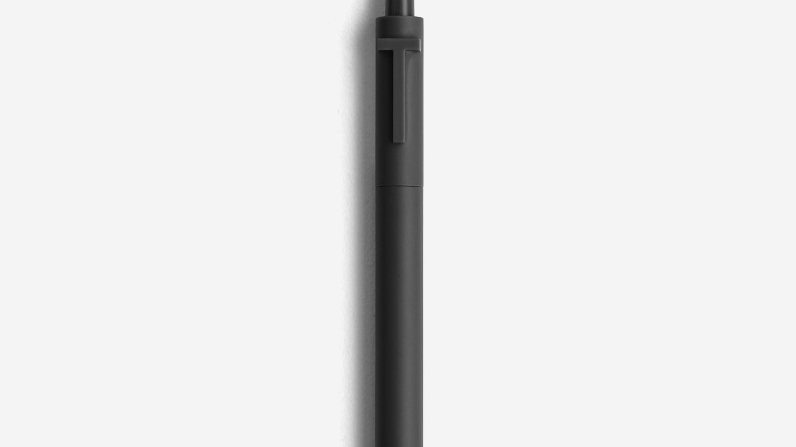 Machined metal everyday carry pen on a notebook